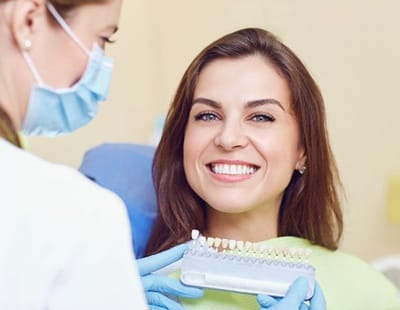 Woman smiling at dentist office