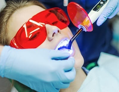 Patient receiving dental sealants