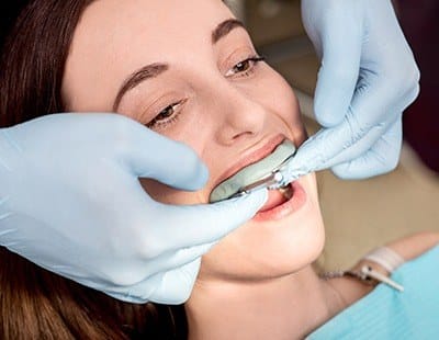 Patient receiving fluoride treatment