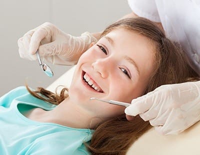 Smiling child in dental chair