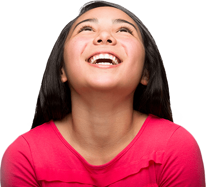 Young girl looking up while laughing