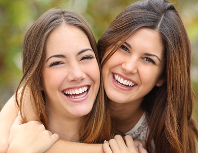 closeup of two young women smiling