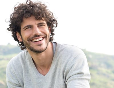 person sitting outside and smiling