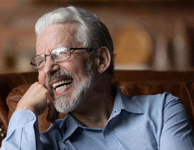 Man laughing with dentures 