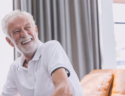 Man smiling with dentures 