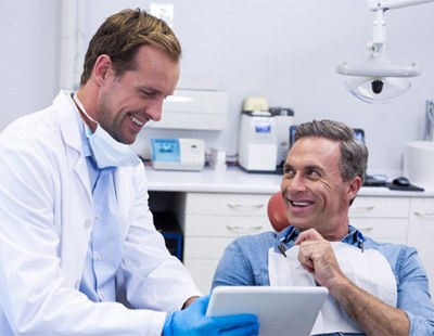 Man smiling in dental chair