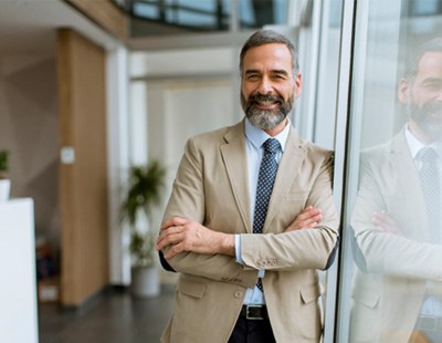 Man smiling in office building