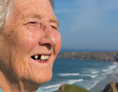 An elderly woman with missing teeth 