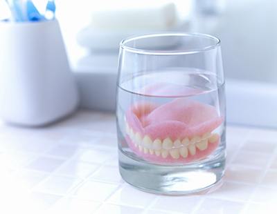 Denture soaking in solution