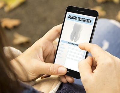 a person looking at their dental insurance coverage on an app on their phone