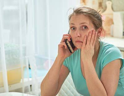 Pained woman calling her Frederick emergency dentist