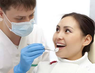 Patient visiting Frederick emergency dentist for routine checkup