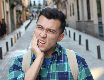 Man with toothache and questions for his Frederick emergency dentist