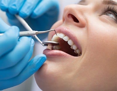 Closeup of patient receiving gum disease treatment