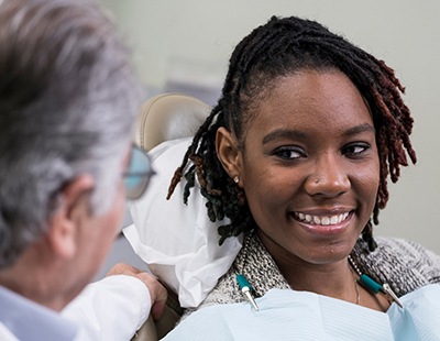 Young female smiling at the dentist