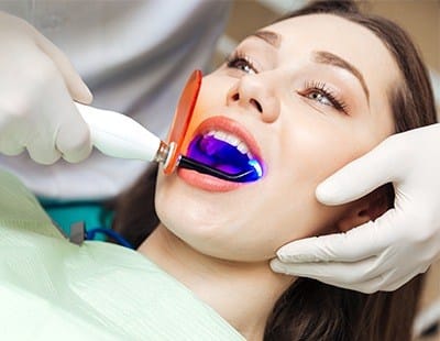 Woman receiving dental bonding