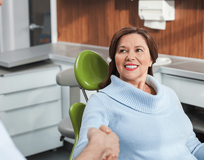 Smiling woman in dental chair