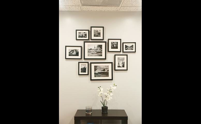 display of framed photos in waiting room