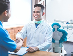 Emergency dentist in Frederick shaking hands with patient