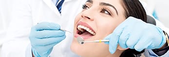 Woman receiving dental exam