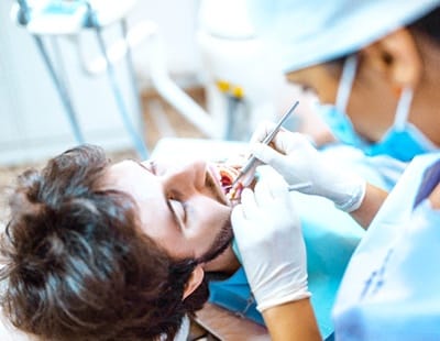 person getting a tooth removed