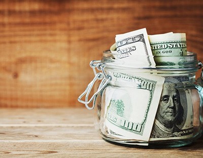 Glass jar full of American money