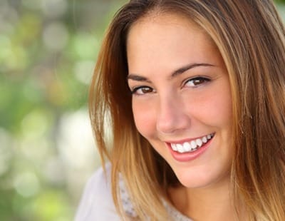 woman smiling outside