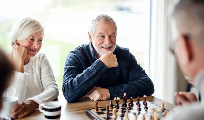 mature man talking with dentures in Frederick