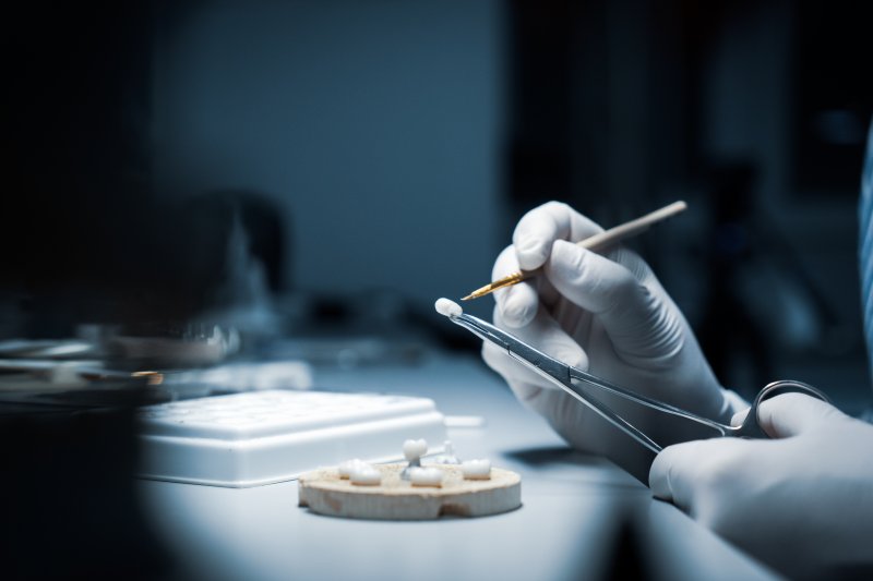 Dentist preparing a dental crown